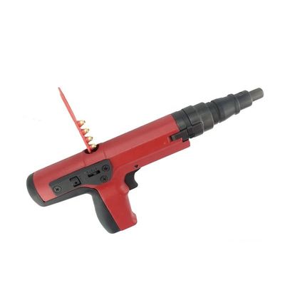 Pistolet à clous décoratif pour tapisseries rouges avec charges de poudre à bande et clous en béton durables